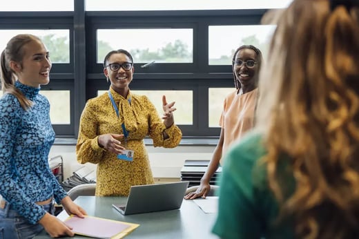 Image of 4 teachers in a discussion