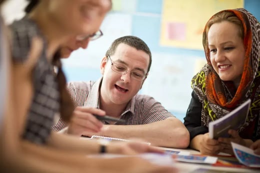 Image of teachers and students in a discussion