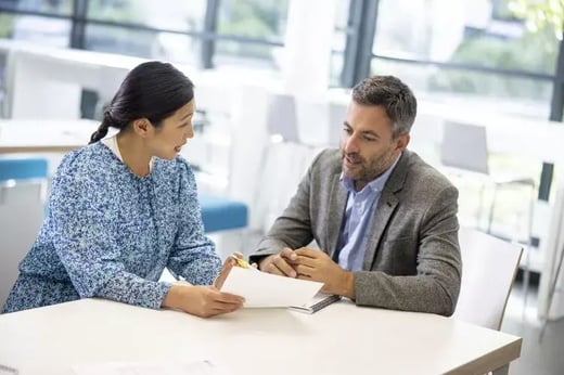 Photo of two teachers in a discussion