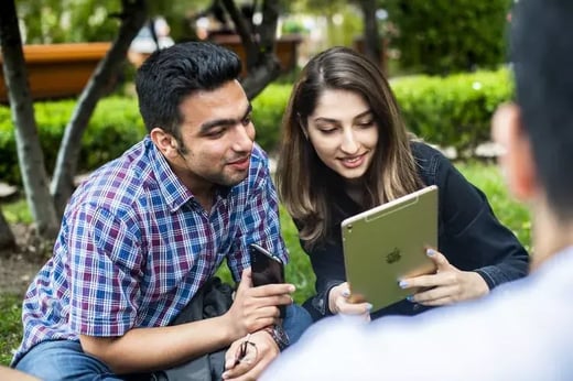 Photo of two teachers using a tablet 1