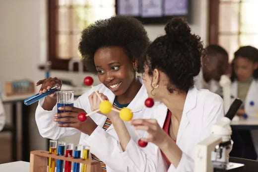 two students working on a science experiment