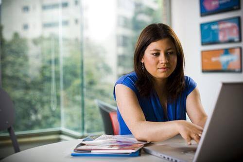 Image of a teacher using a computer. 